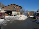 Le parking avec la ferme de Mex