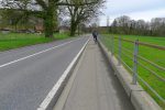 Départ par la route d'Oron sous un ciel gris